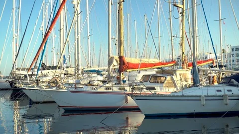 Masts of ships are reflected in the water. Modern ships are in the bay. Top down Stock Footage 120073718