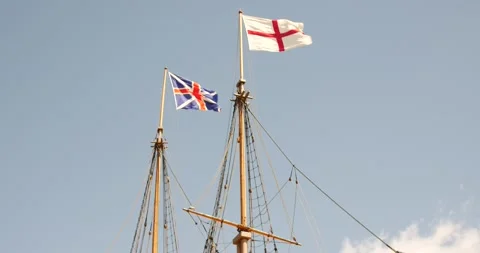 Masts of a tall ship flying the flags of the United Kingdom Stock Footage 151568088