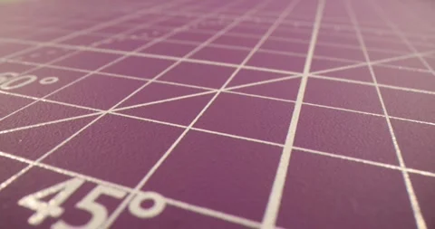 Mat with measuring stencil for cutting paper or fabric macro Stock Footage 247403224