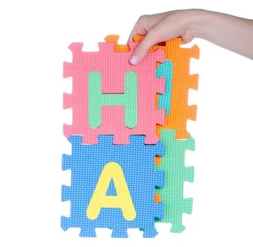 Mat puzzles alphabet in hand Stock Photos