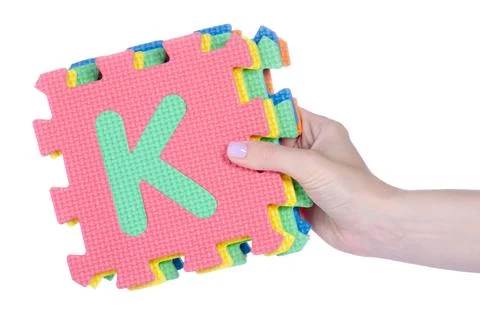 Mat puzzles alphabet in hand Stock Photos