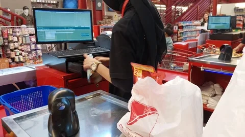 Matahari Store cashier is checking the total of the customer's purchases Stock Footage 290019098
