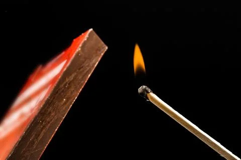 Match and box arson on black background Stock Photos