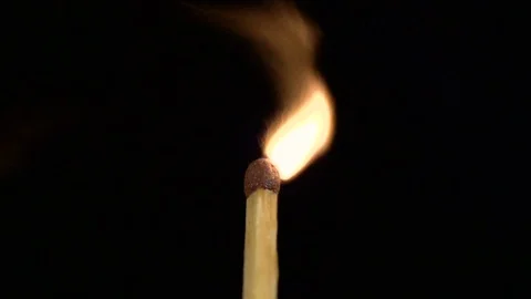 The match breaks out and lights up with the help of a high-speed camera sony Vídeos de archivo 83998582