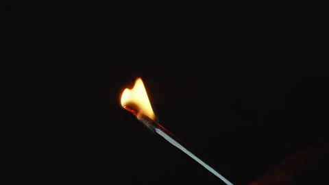 A match burning on a black background, close up Stock Footage 246879820