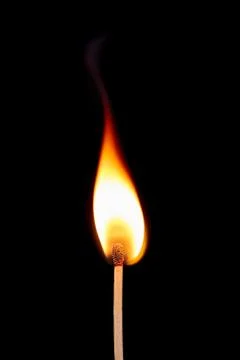 Match on fire on a black background Stock Photos