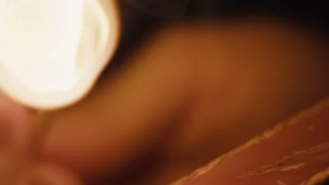 Match fire ignited by female hand macro close up slow motion at night Stock Footage 149940048