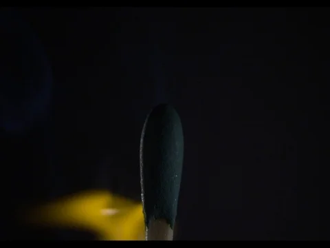 Match head lights up and burning, macroshot, slow motion, Ignition of fire Stock Footage 74334266