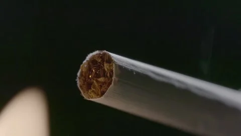 Match ignited cigarette slow motion closeup.Burning cigarette with filter Stock Footage 132185051