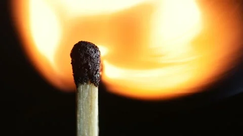 Match lighting burning.  Macro shot on black background. Slow motion. Stock Footage 61361975