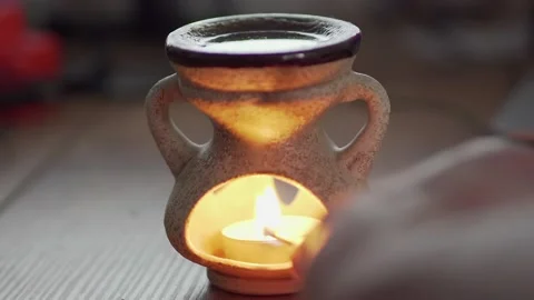 Match lighting close-up with single candle flame Stock Footage 156588561