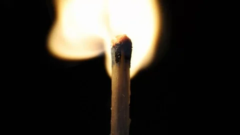 Match lighting with jet flame lighter. Black background Stock Footage 108398699