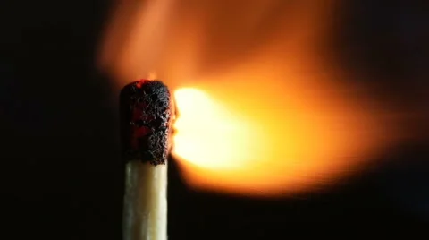 Match lighting long burning.  Macro shot on black background. Slow motion. Stock Footage 61361942