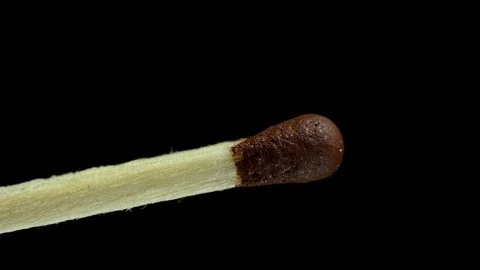 Match lights up on a black background Stock Footage 120685997