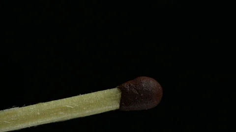 Match lights up on a black background Stock Footage 120686150