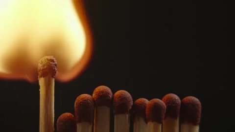 The match lights up first to light all the rows of matches behind it.  Stock Footage 283156398