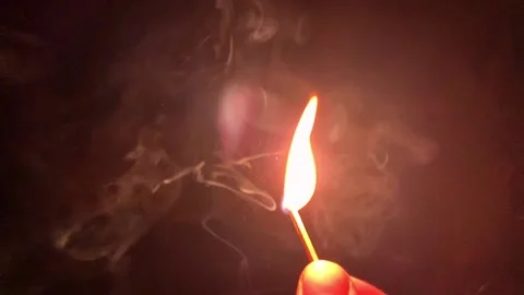 The match is lit in the dark on black background. HD slow motion Stock Footage 179955252