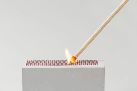 Match lit on a Matchbox Stock Photos