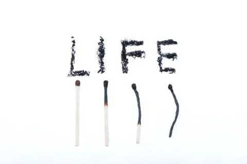 A match lying on a white background Stock Photos