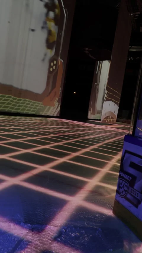 Match moments loop on arena screen while ice resurfacer glides rink Stock Footage 303065532