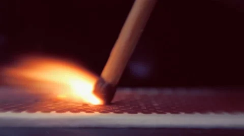 The match moves on the side of the matchbox and light the fire. Macro 動画素材 61550777