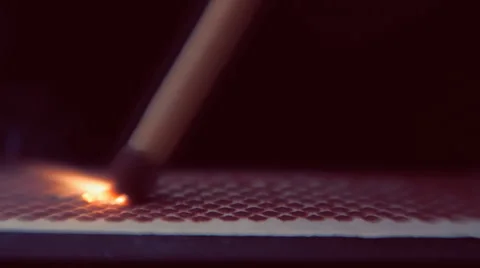 The match moves on the side of the matchbox and light the fire. Macro 動画素材 61550849