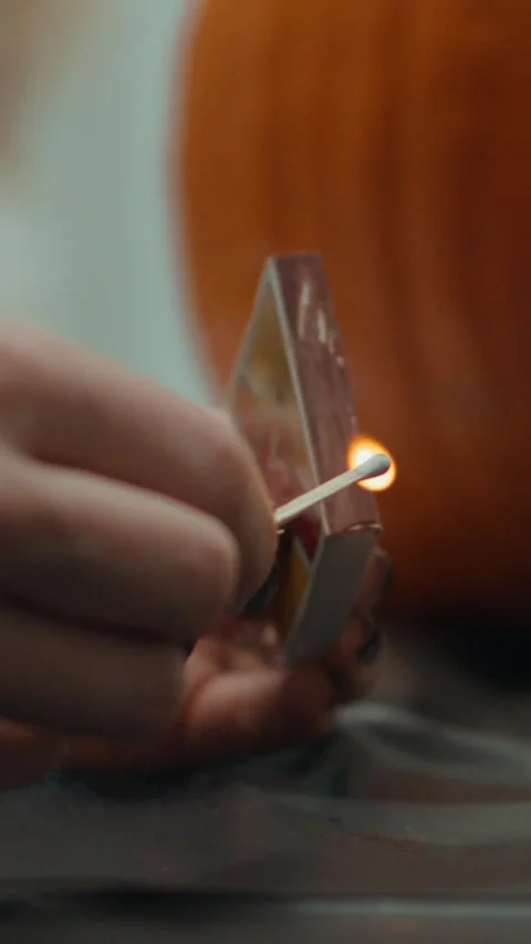 Match Strike In Front of a Pumpkin Vertical Video Slow Motion Stock Footage 308195674