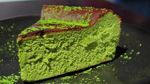 Matcha basque cheesecake sliced and ready to serve. Stock Footage 307592775