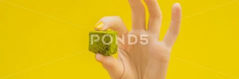 Matcha candy on yellow background. Homemade Matcha BANNER, LONG FORMAT Stock-Fotos