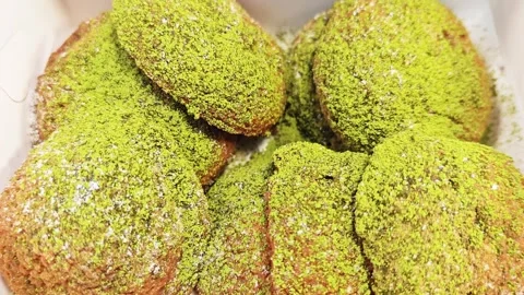 Matcha green tea chouquettes or choux pastry puffs with pearl sugar. Stock Footage 345293445