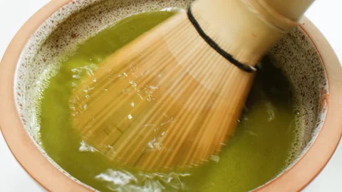 Matcha green tea cooking process, japanese powder green tea in a bowl with Stock Footage 309631739