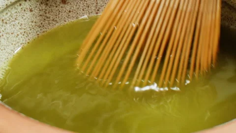 Matcha green tea cooking process, japanese powder green tea in a bowl with Stock Footage 309634883