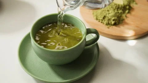 Matcha green tea cooking process, japanese powder green tea in a bowl with Stock Footage 309635111
