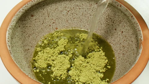 Matcha green tea cooking process, japanese powder green tea in a bowl with Stock Footage 309644893