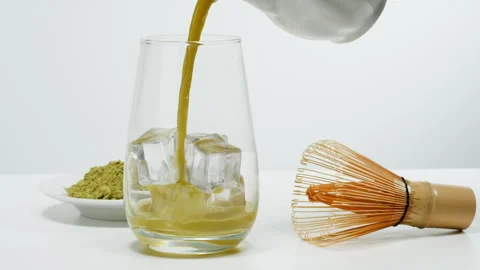 Matcha green tea cooking process, japanese powder green tea in a bowl with Stock Footage 309647144