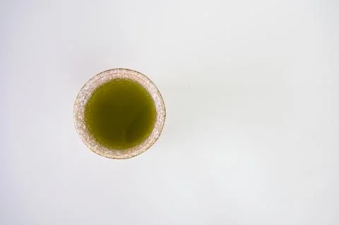 Matcha Green Tea Served in Rustic Ceramic Cup Viewed From Above on White Ba.. Stock Photos