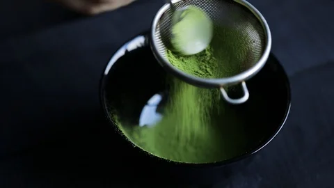 Matcha green tea is sift through a sieve Stock Footage 119095431