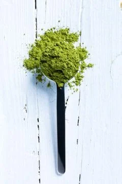 Matcha green tea on spoon Stock Photos