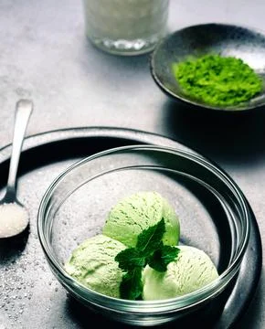 Matcha Ice Cream with Mint Leaf in bright grey background Stock Photos