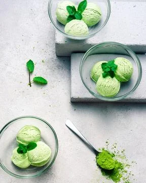 Matcha Ice Cream with Mint Leaf in bright grey background Stock Photos