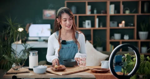 Matcha, live stream and phone with woman in home for green tea tutorial Video stock 336310763