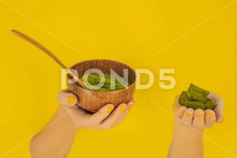 Matcha powder and candy made of matcha on yellow background. Homemade Matcha Stock-Fotos