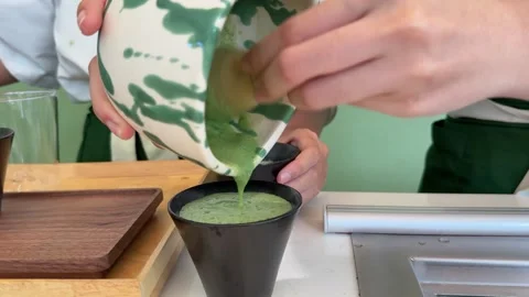 Matcha preparation Step by step tutorial making Japanese matcha tea. Step five Video stock 317811148