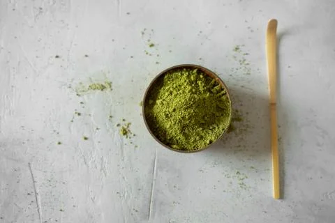 Matcha tea in a brown cup on a gray background Stock Photos