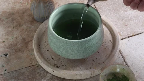 Matcha Tea Ceremony. Matcha Still Life. A refreshing matcha served with ceramic Stock Footage 320561513