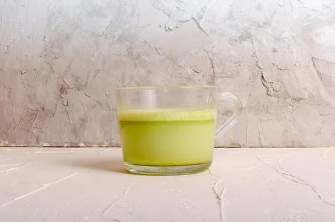 Matcha tea cup with spoon on light grey background Stock Illustration