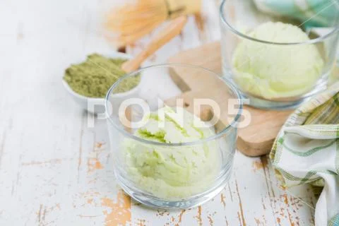 Matcha tea ice cream on white wood background Stock Photos