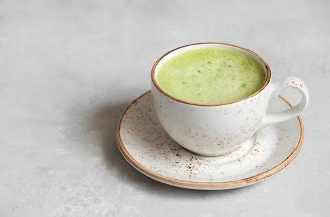 Matcha tea latte close up on a gray concrete background. Japanese green tea.  Stock Photos