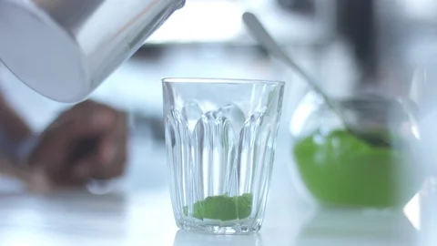Matcha tea preparation in cafe by mixed race barman Stock Footage 87908412