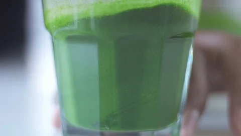 Matcha tea preparation in cafe by mixed race barman Stock Footage 87908688